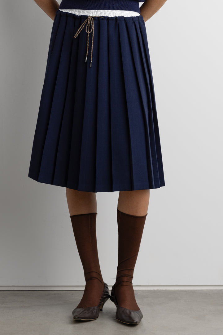 EXPOSED WAIST PLEATED MIDI SKIRT