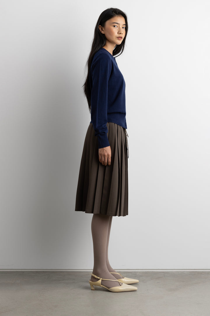 EXPOSED WAIST PLEATED MIDI SKIRT